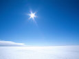 The Sun Appears as a Bright Pointed Star in a Crisp Blue Polar Sky